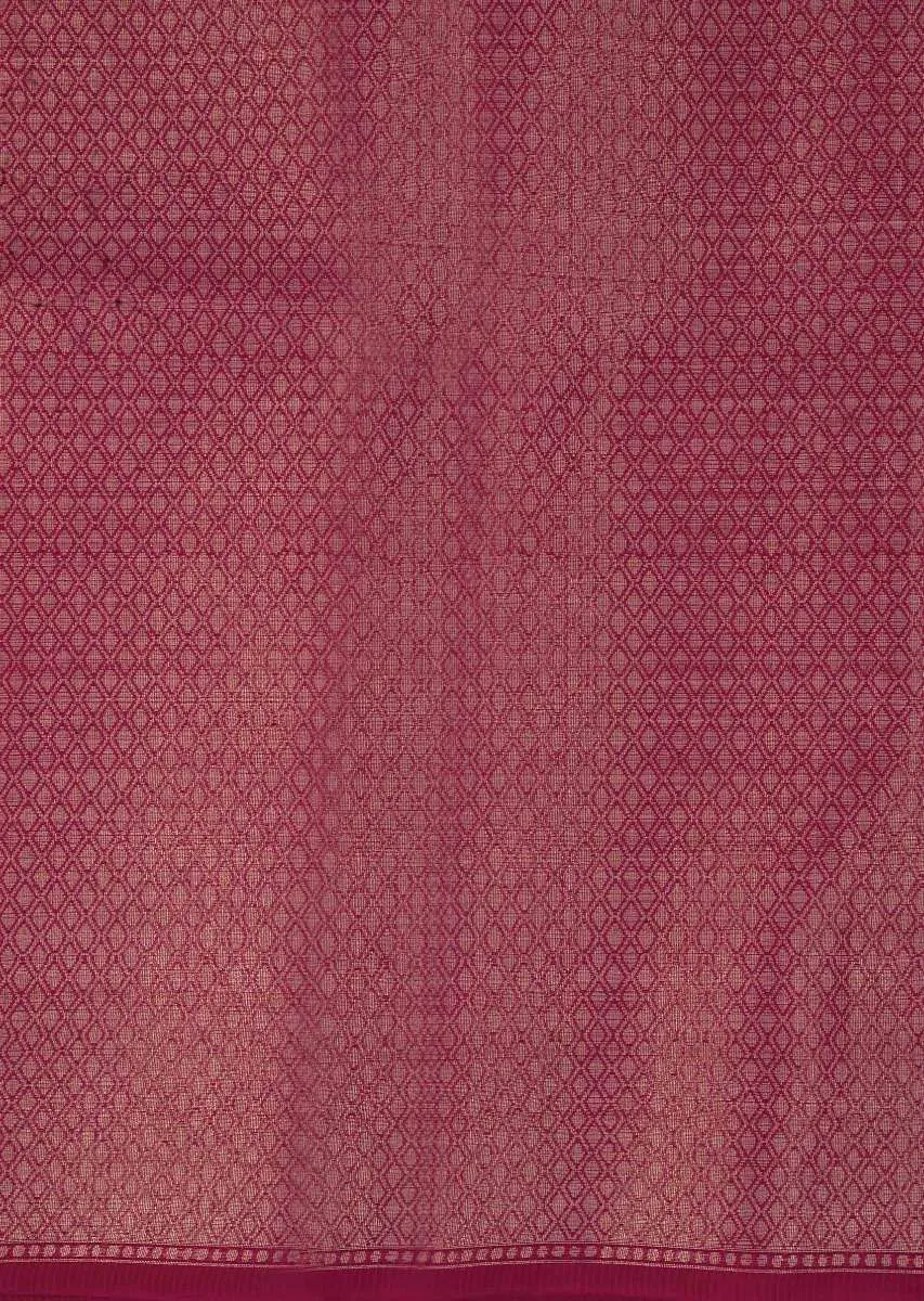 Coral red tussar silk saree with weaved work in floral motif only on Kalki