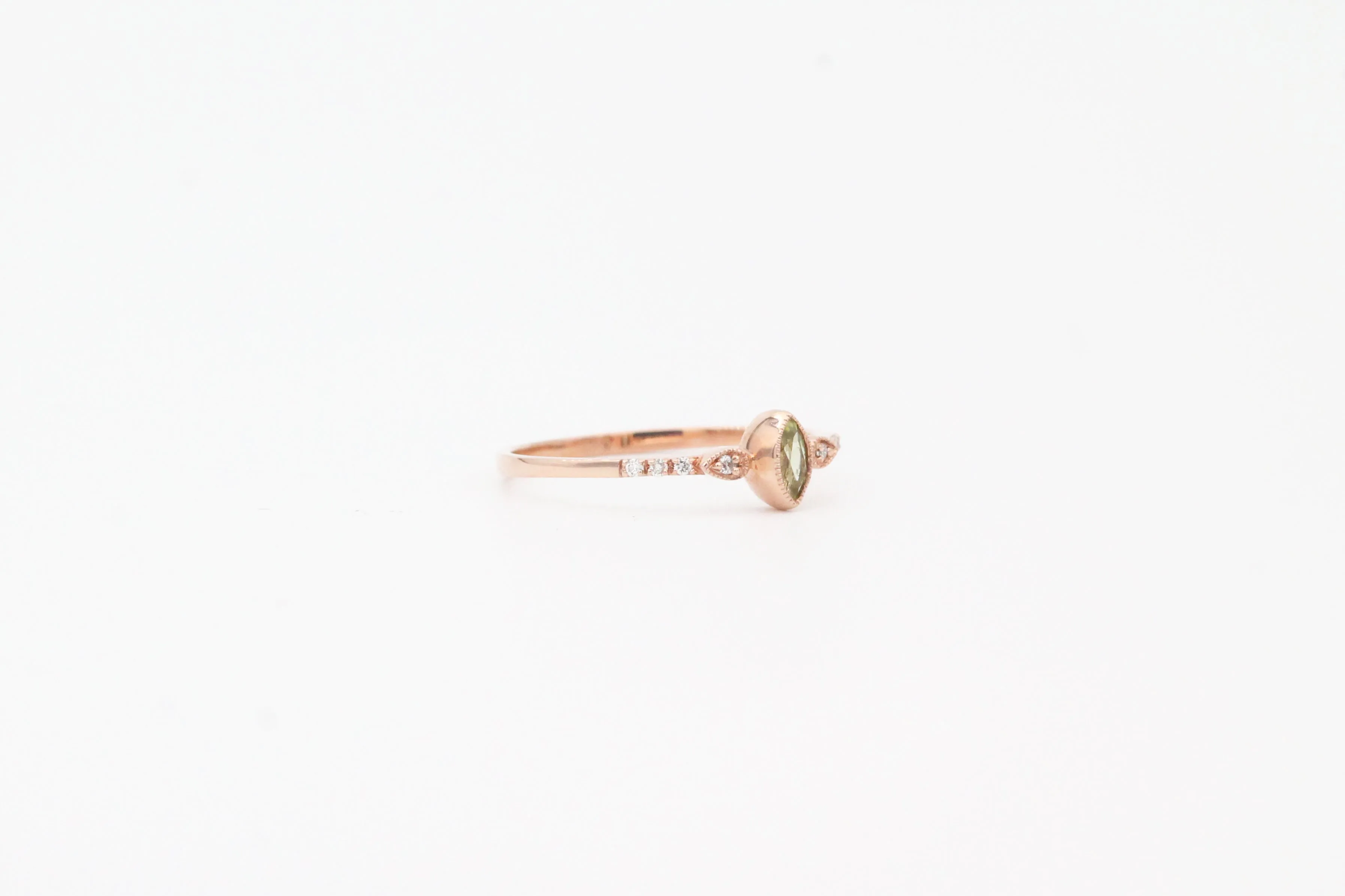 Rose Gold Marquise Cut Bezel Set Peridot and Diamond Ring